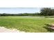 Expansive golf course with serene pond and fountain, providing a tranquil and scenic environment at 17727 Garsalaso Cir, Brooksville, FL 34604