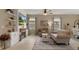 Comfortable living room features a built-in entertainment center and a cozy seating arrangement, perfect for relaxation at 17727 Garsalaso Cir, Brooksville, FL 34604