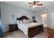 Cozy main bedroom featuring ceiling fan, wall decor and natural light at 17727 Garsalaso Cir, Brooksville, FL 34604