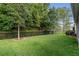 Spacious backyard with lush green grass and black fence line at 17843 Garsalaso Cir, Brooksville, FL 34604
