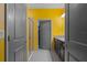 Vibrant bathroom with a sleek glass shower, granite counters, modern fixtures, and a walk-in closet at 17843 Garsalaso Cir, Brooksville, FL 34604