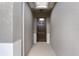 Inviting entryway featuring a stylish front door, neutral walls, and a view of the home's interior at 17843 Garsalaso Cir, Brooksville, FL 34604