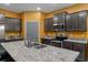 Stylish kitchen with granite countertops, stainless steel appliances, and ample cabinet space at 17843 Garsalaso Cir, Brooksville, FL 34604