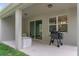 Covered patio with outdoor furniture and grill at 17843 Garsalaso Cir, Brooksville, FL 34604