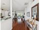 Warm and inviting entryway features hardwood floors, neutral decor, and plenty of natural light at 18845 Fairway Green Dr, Hudson, FL 34667