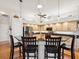 Kitchen featuring a bar with seating, stainless steel appliances, light wood cabinetry, and an open design at 18845 Fairway Green Dr, Hudson, FL 34667