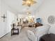 Bright living room featuring comfortable seating, decor, and ceiling fans at 18845 Fairway Green Dr, Hudson, FL 34667