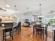 Open concept living space featuring a kitchen, dining area, and living room with natural light and stylish decor at 18845 Fairway Green Dr, Hudson, FL 34667