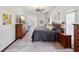 Spacious main bedroom showcasing wood floors, a ceiling fan, and neutral decor at 18845 Fairway Green Dr, Hudson, FL 34667