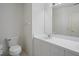 Bright bathroom featuring a toilet, sink, and a well-lit vanity at 2165 Springmeadow Dr, Spring Hill, FL 34606