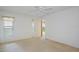 Well-lit bedroom with carpet, ceiling fan and bright, natural light at 2165 Springmeadow Dr, Spring Hill, FL 34606