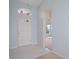 Bright entryway with tiled floor and transom window over the front door, leading to the living area at 2165 Springmeadow Dr, Spring Hill, FL 34606