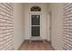 Inviting entryway featuring a decorative front door and tile flooring leading into the home at 2165 Springmeadow Dr, Spring Hill, FL 34606