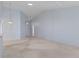 Spacious living room features high ceilings, neutral paint and flooring, and ample natural light at 2165 Springmeadow Dr, Spring Hill, FL 34606