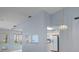 Bright living room area open to the kitchen, with vaulted ceilings and plenty of natural light at 2165 Springmeadow Dr, Spring Hill, FL 34606