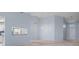 Open-concept living and dining area with a view of the kitchen and entry to the home at 2165 Springmeadow Dr, Spring Hill, FL 34606