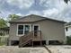 Back of the home showcasing the back entrance and raised foundation at 221 Highland St, Brooksville, FL 34601