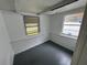 Finished basement features a new paint job, updated flooring, and window with natural light at 221 Highland St, Brooksville, FL 34601