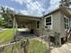 Covered carport area with a view of the back and side of the home at 221 Highland St, Brooksville, FL 34601