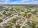 The property is ideally located in a vibrant neighborhood, as seen from an aerial view at 2450 Ambassador Ave, Spring Hill, FL 34609