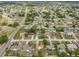 A bird's eye view shows the property's location within a peaceful residential neighborhood at 2450 Ambassador Ave, Spring Hill, FL 34609