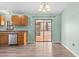 Kitchen with stainless steel appliances, light wood cabinets, and wood look flooring at 2450 Ambassador Ave, Spring Hill, FL 34609