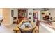 Elegant dining room featuring a glass-top table with seating for six at 2481 Whispering Pines Ct, Spring Hill, FL 34606