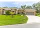 Charming single-story home with a well-manicured lawn and a screened garage in a serene neighborhood at 2481 Whispering Pines Ct, Spring Hill, FL 34606