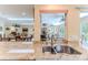The kitchen is connected to the living room at 2481 Whispering Pines Ct, Spring Hill, FL 34606