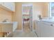 A laundry room featuring a utility sink and a washer and dryer at 2481 Whispering Pines Ct, Spring Hill, FL 34606