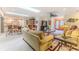 Bright living room with ample natural light, comfortable seating, and stylish furnishings at 2481 Whispering Pines Ct, Spring Hill, FL 34606