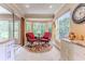 Cozy sunroom with comfortable chairs and an inviting view at 2481 Whispering Pines Ct, Spring Hill, FL 34606