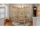 Breakfast Nook with round wood table, four chairs, a rug and an abundance of natural light at 2486 Deer Trail Ln, Spring Hill, FL 34606