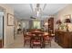 Spacious dining area with seating, view to front door and living room at 2486 Deer Trail Ln, Spring Hill, FL 34606