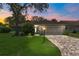 Lovely home featuring a well-manicured lawn, ample driveway, and an attached two-car garage at 2486 Deer Trail Ln, Spring Hill, FL 34606