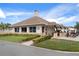 Charming golf pro shop featuring large windows, a cozy entrance, and golf cart parking at 2486 Deer Trail Ln, Spring Hill, FL 34606