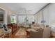 Bright sun room filled with natural light, comfortable furniture, and a ceiling fan at 2486 Deer Trail Ln, Spring Hill, FL 34606