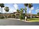Community clubhouse with landscaping at 2542 Sandy Hill Ct, Holiday, FL 34691