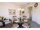 Charming dining area with glass table, decorative chairs, and elegant chandelier lighting at 2542 Sandy Hill Ct, Holiday, FL 34691