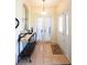 Welcoming foyer with tile flooring, decorative table, and arched doorway at 2542 Sandy Hill Ct, Holiday, FL 34691