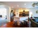 Stylish kitchen and living area with stainless steel appliances and counter seating at 2542 Sandy Hill Ct, Holiday, FL 34691