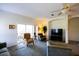Inviting living room with sliding doors to the patio and cozy seating at 2542 Sandy Hill Ct, Holiday, FL 34691