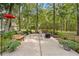 Serene backyard patio surrounded by lush greenery and mature trees at 27091 Country Oak Dr, Brooksville, FL 34602