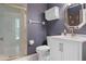 This beautiful bathroom has patterned wallpaper, white tile, and a glass shower at 27091 Country Oak Dr, Brooksville, FL 34602