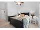 A serene bedroom with a cozy bed, wood floors, and soft lighting at 27091 Country Oak Dr, Brooksville, FL 34602