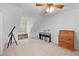Cozy attic bedroom featuring a built-in bench, musical keyboard, and bright natural light at 27091 Country Oak Dr, Brooksville, FL 34602