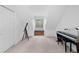 Cozy attic bedroom featuring a telescope, musical keyboard, and bright natural light at 27091 Country Oak Dr, Brooksville, FL 34602