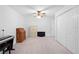 Spacious bedroom featuring plush carpeting, a ceiling fan, and ample closet space at 27091 Country Oak Dr, Brooksville, FL 34602