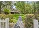 Inviting home featuring a stone walkway, lush green lawn and privacy at 27091 Country Oak Dr, Brooksville, FL 34602
