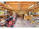 View of the garage with wood ceiling and exposed beams; good lighting at 27091 Country Oak Dr, Brooksville, FL 34602